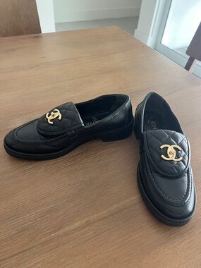 CHANEL Black Quilted Leather Loafers with Gold CC Accent